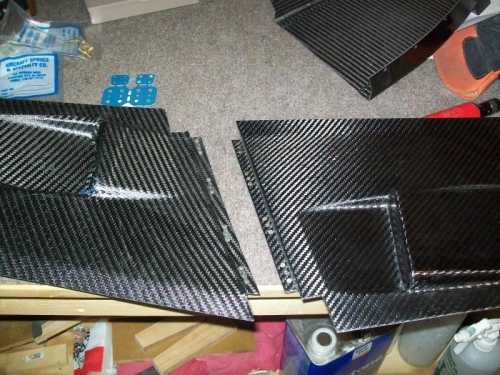 Nutplates mounted to the lower side panels