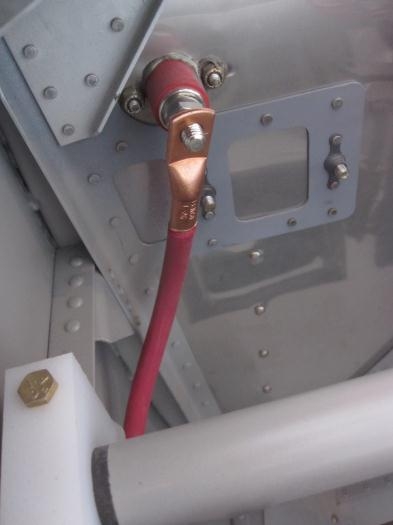 Power pass through on the aft side of the firewall