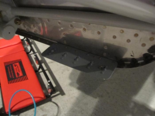 Bottom cowl mounting plate riveted