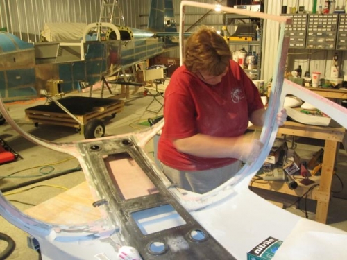 Janice sanding the cabin cover