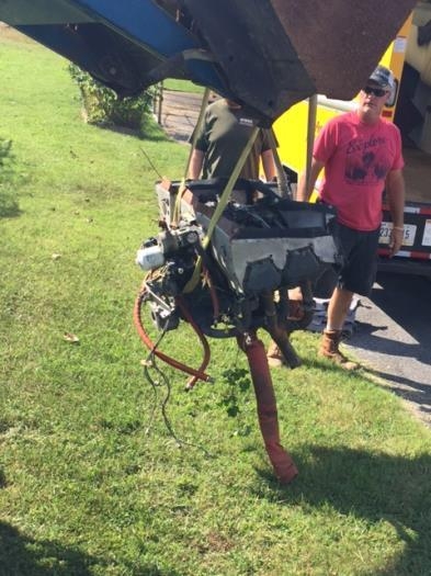 And finally, the engine. Thank goodness for the neighbor with a front loader!