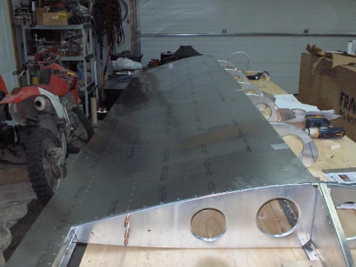 Getting the pre drilled holes lined up with the ribs and spar