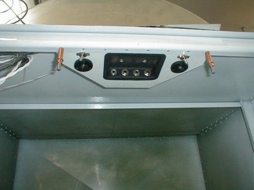 Located centered behind my head to the baggage roof