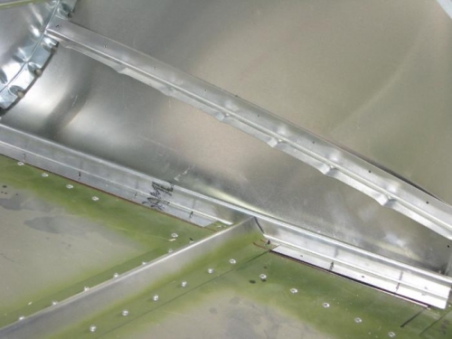 Hand crimped L angle on side skin