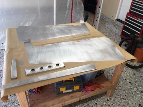 A mix of rudder and vertical stabilizer parts prepped and ready for priming.