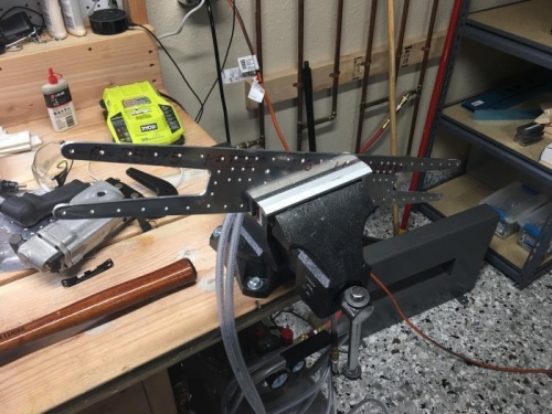 A combination of hand filing, sanding and bench grinding finishes the doubler.