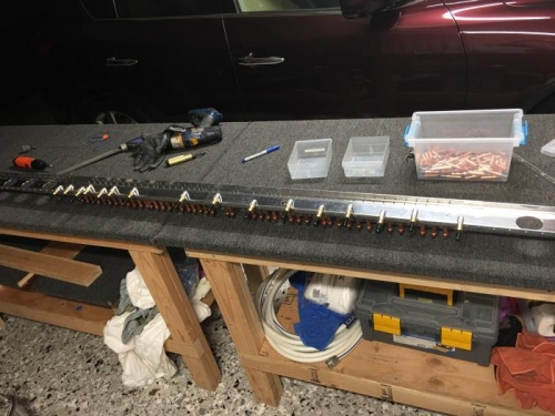 After deburring the doubler is clecoed and clamped in position for match drilling thru the flange.