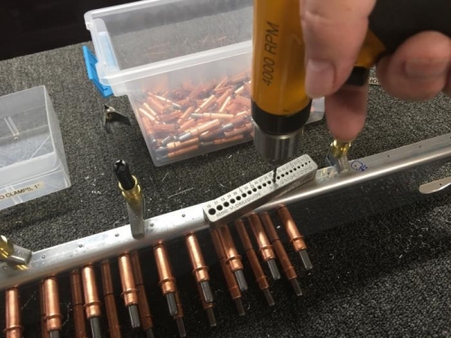 Using a drill guide to get good holes.  This is a two handed operation, but I needed a picture.