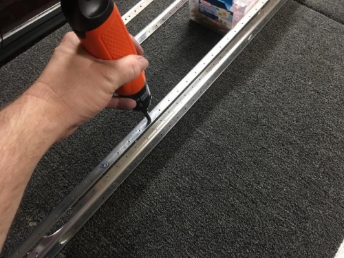 Deburring the holes with my electric screwdriver and a deburring bit.