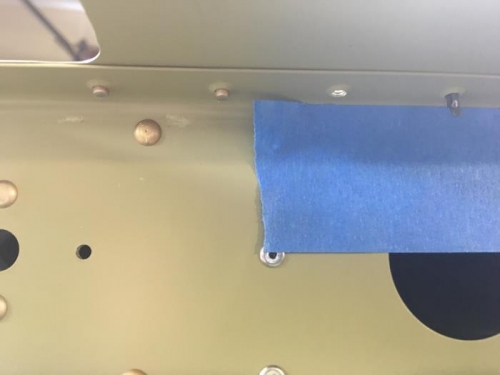 When riveting the bucking bar leave marks.  Painters tape helps mitigate that.