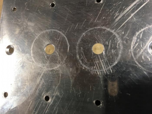Hole on the right is C/S for rivet.  On the left is for a dimple.  Difference is 0.007 in. depth.