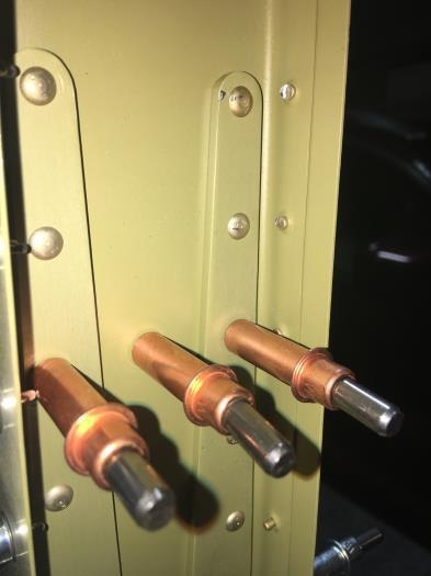 The upper two rivets on the right got a bad squeeze.  They need to come out.