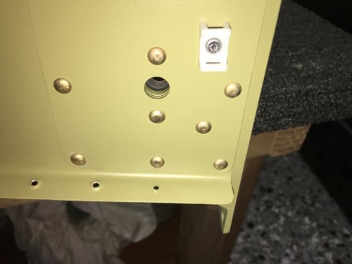 Middle bottom rivet head interferes with dimpling the flange hole.