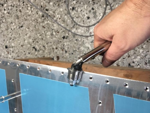 A slight bend is put into the trailing edge skin so it will lay flat after riveting.