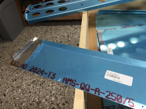 Trim tab skin is damaged on the corner.