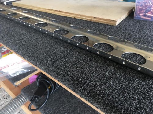 Lots of holes to countersink.  There are a couple of less-than-perfect countersinks though.