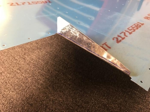 Did a bang up job on the upper skin tab, literally! Half moon dents everywhere. Note the bend offset.