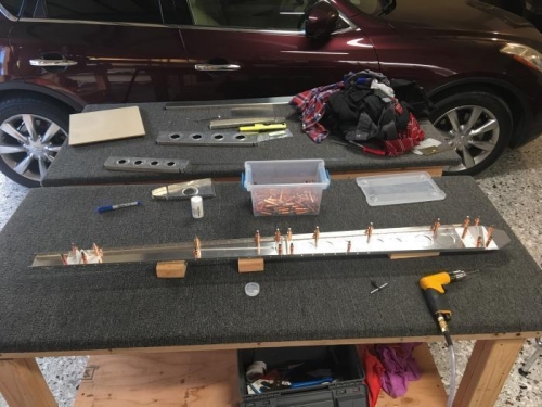 Rear spar cleco'ed and match drilled. Yes that's my laundry waiting for the washer to finish.