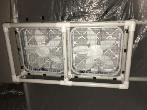 Fans fit in place almost perfectly.  Duct tape around the sides seals it up.