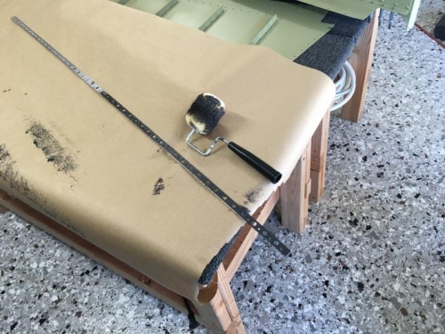 Applying sealant with roller.  I ended up using a foam roller instead of the fuzzy one pictured here.