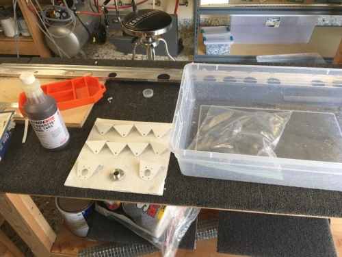 Preparing to apply Bonderite (Alodine) to bracket holes.