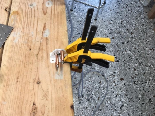 Riveting hinge bearing assembly together.