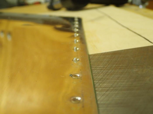 Riveting against backing plate