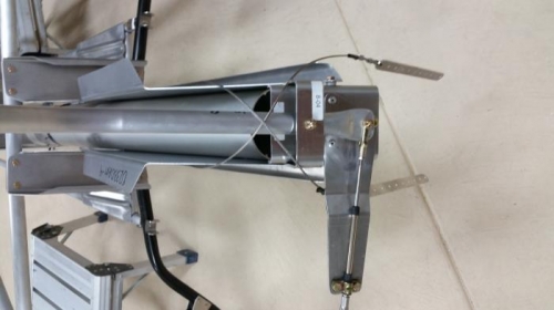 Fwd cable attached to stick and bent arm