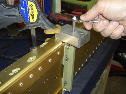 Use of a drill block to guide tap straight