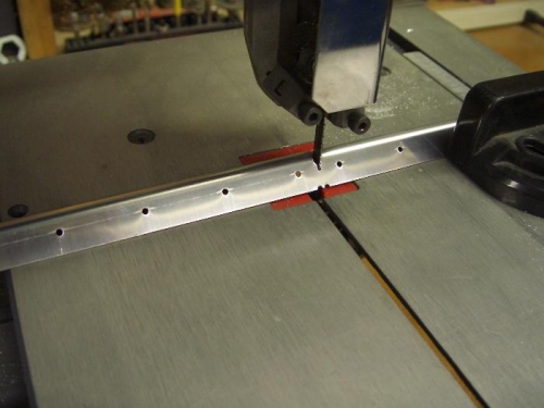 Initial cutting of stiffeners from strip at notches