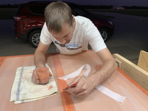 Bryan laying down a 2 inch tape on the left wing near the wing root