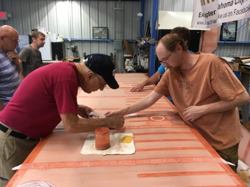 Matt and Pete laying down tapes on bottom of left wing