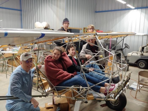 Most of the crew with a cockpit fitting