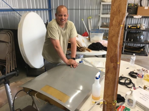 Jay sealing the fuel cap entrance to check the tank for leaks.