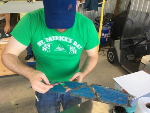 Craven applies glue to wing lock side