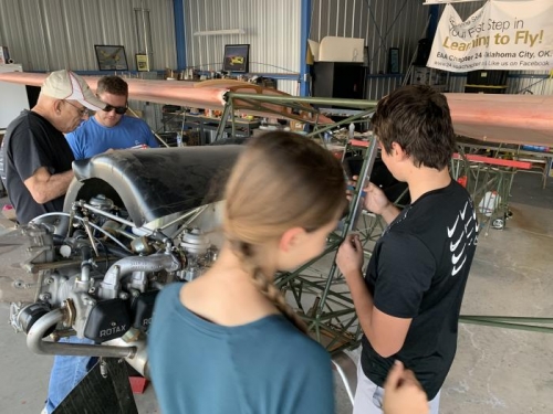 victoria and Antonin work to fit a windshield bracket