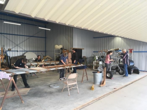 the whole crew is out sanding, varnishing, and painting!