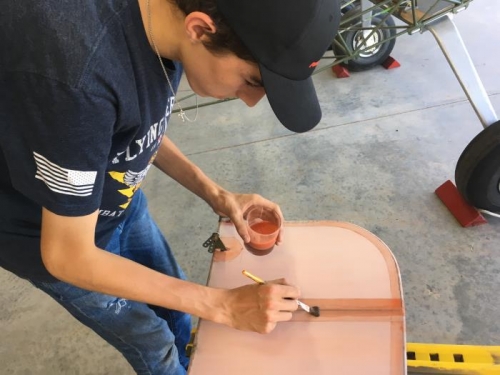 Lawson applies polybrush in preparation for laying down 2