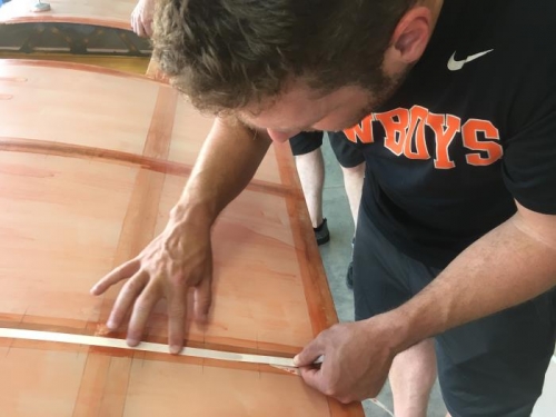 Eric applies the reinforcing strips that will go below the rib laces