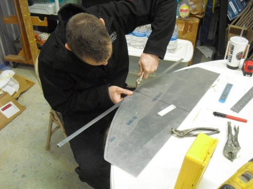 Brian begins attaching reinforcement/windscreen attachment angle to instrument panel
