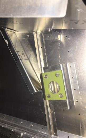 Bracket fitted under baggage shelf