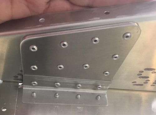 Fuel tank bay bracket riveted - note rivets