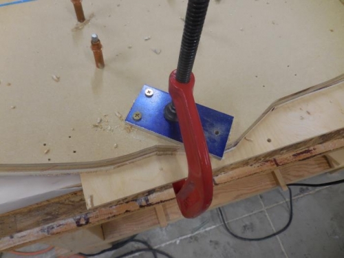 Drill Jig clamped in place and two holes drilled, screws placed in drilled holes to help secure jig