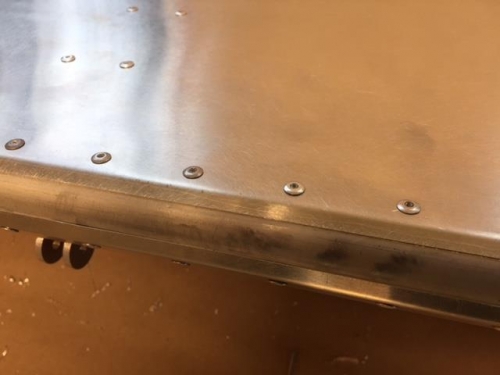 Rivets installed bottom of left flap