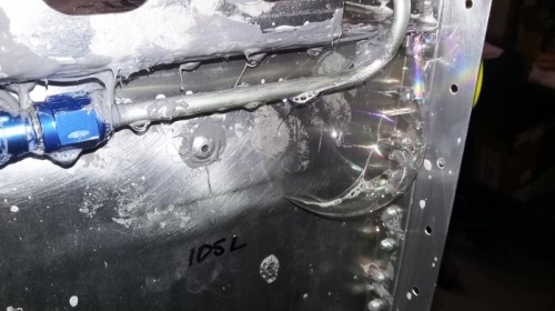 leak in corner seam of left tank