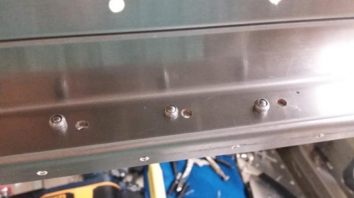drilled new rivet holes in top rail