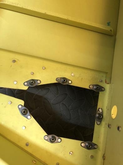 edges of nut plates overhang the skin and need to be trimmed flush to allow the trim servo to fit