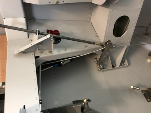 New connecting strut to accomodate rudder trim cable