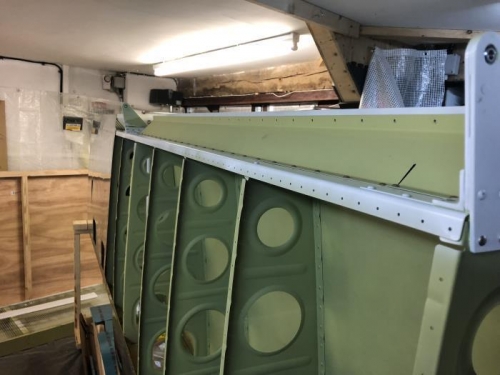 Aileron brace rivetted to spar