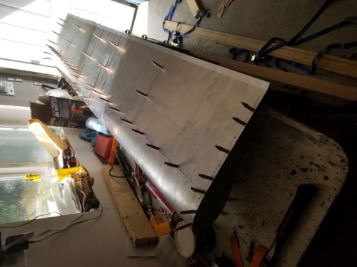 Top skin stretched in place, fastened with clecos